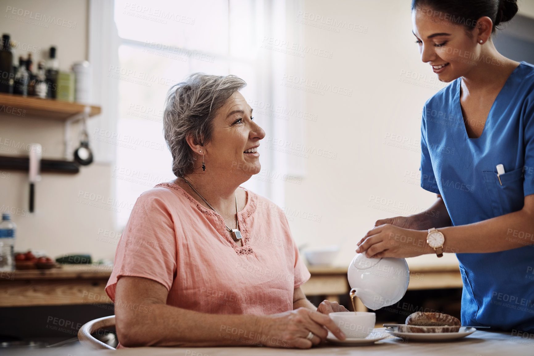 Buy stock photo Caregiver, smile and woman with tea in nursing home kitchen for breakfast, relax or healthy nutrition of support. Nurse, patient and food for senior care with helping, trust or serving at retirement
