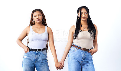 Buy stock photo Couple, holding hands and serious with women in fashion for lgbtq, support and queer on white background. Lesbian, partner and people with unity in love for gay pride, solidarity and care together