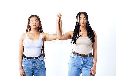 Buy stock photo Couple, holding hands and serious with women in studio for lgbtq, support and fashion on white background. Lesbian, partner and people with care in unity for pride, solidarity and queer together