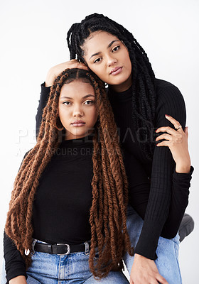 Buy stock photo Sisters, portrait and style in studio, embrace and bonding on white background. Women, friends and care for relationship on backdrop, casual outfit and matching trend for gen z fashion or support