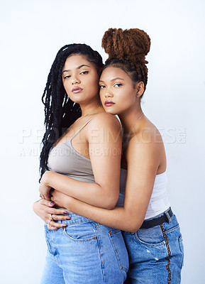 Buy stock photo Studio, portrait and lgbtq with women in fashion for solidarity, support and gay pride on white background. Serious, lesbian and couple with embrace in love for care, style and confidence together