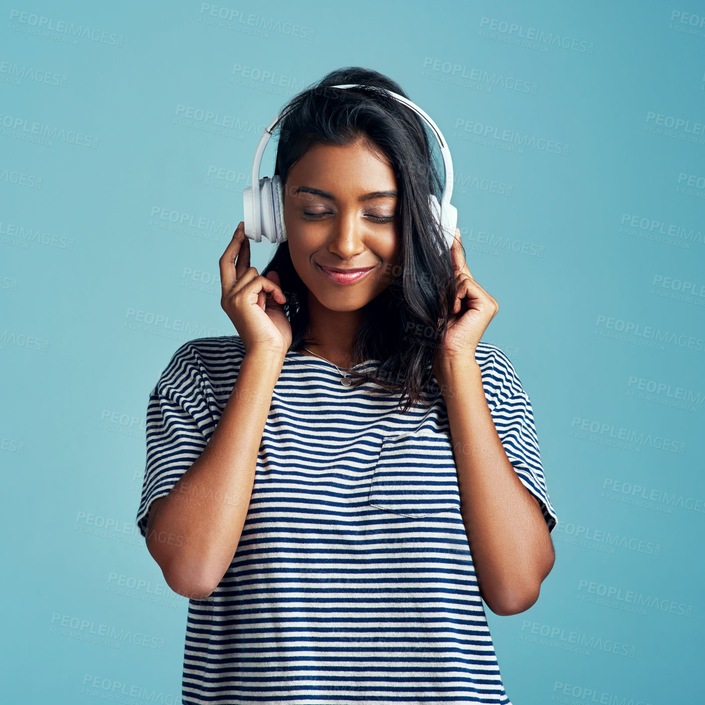 Buy stock photo Woman, studio and headphones with happy music, listening and streaming podcast for calm with gen z. Radio audio, technology for song entertainment with sound, Indian female person on background