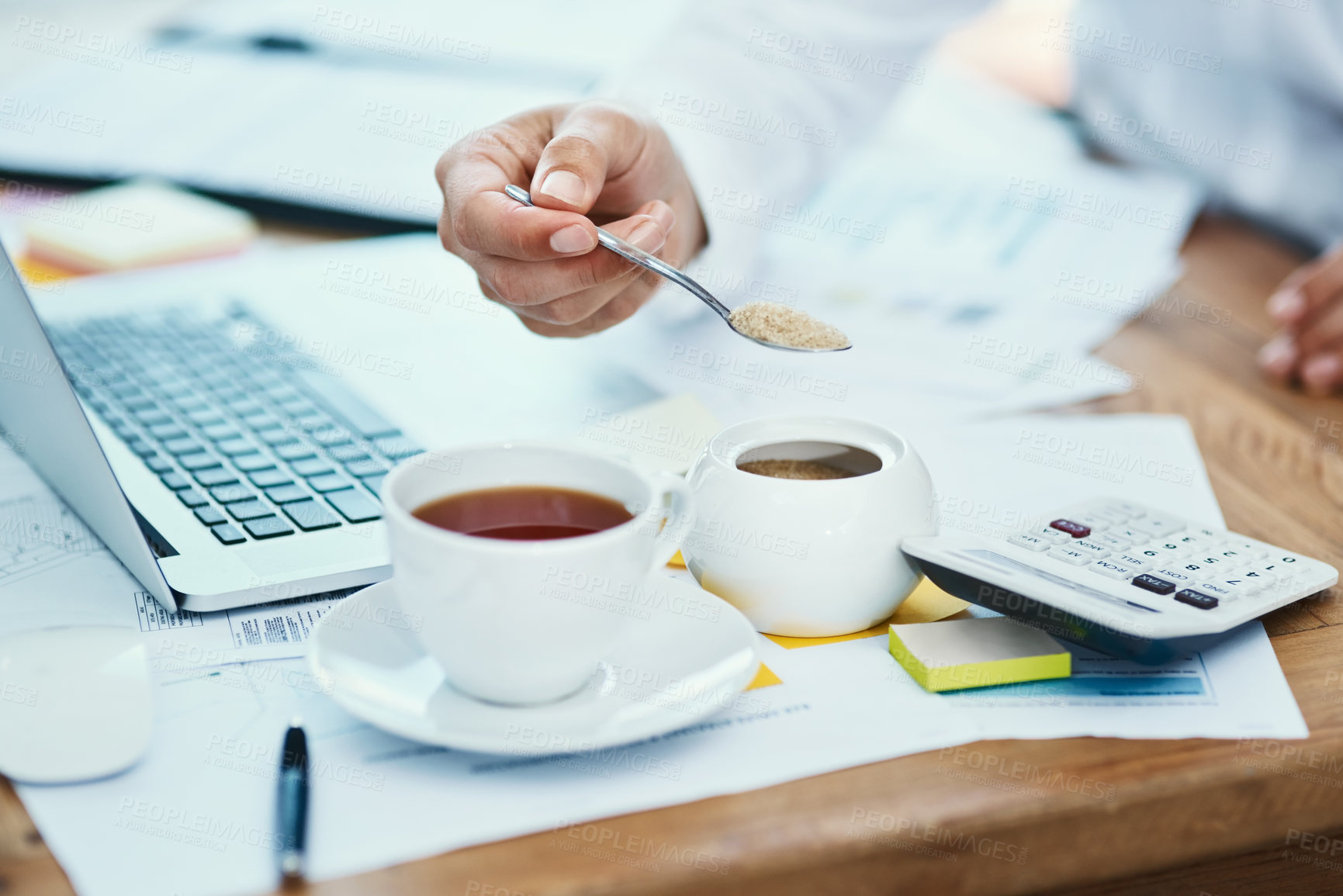 Buy stock photo Coffee, sugar and hand of person in office with tech, dairy free and hot drink in business. Finance employee, black tea or sweetener at desk for refreshment, caffeine addiction or morning on new day