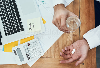 Buy stock photo High angle shot of an unrecognizable businessman holding a glass of water and medication in an office