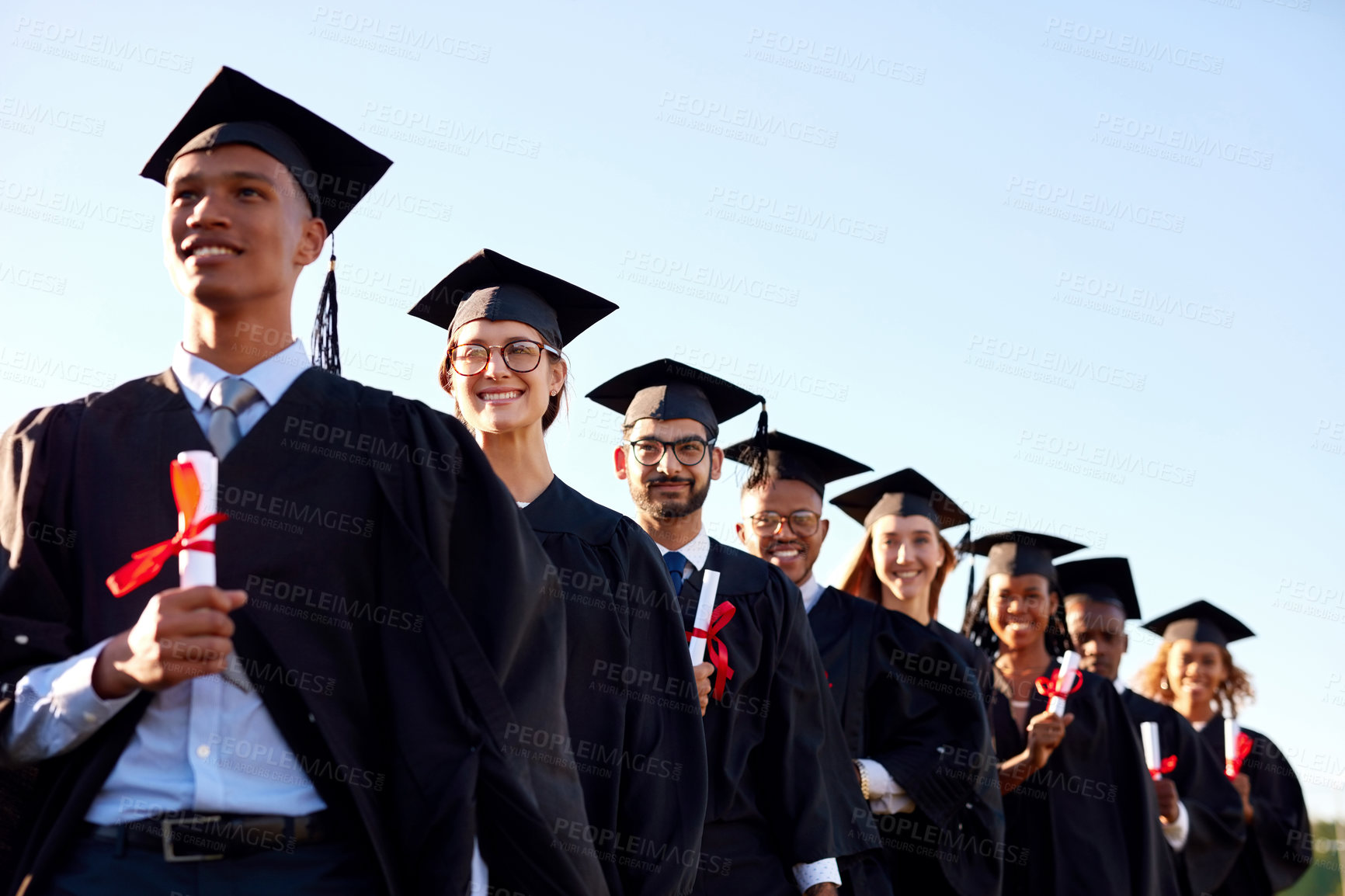 Buy stock photo Graduation, sky or class of students with certificate at university for education, learning or success. College group, outdoor or happy people at campus with degree, pride or diploma for empowerment