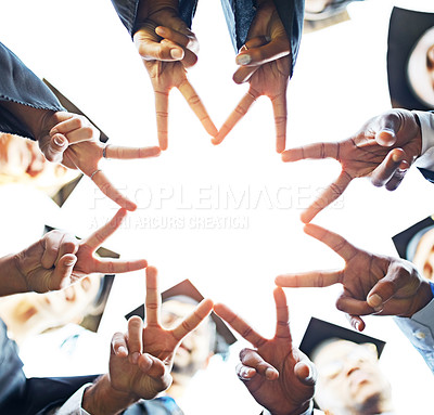 Buy stock photo Closeup shot of a group of students joining their fingers together on graduation day