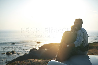 Buy stock photo Back, hug and road trip with couple at sunset together for holiday, travel or vacation in nature. Adventure, bonding or sea with man and woman embracing in love for anniversary, honeymoon or romance