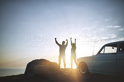 Buy stock photo Shot of a young couple making a stop at the beach while out on a road trip