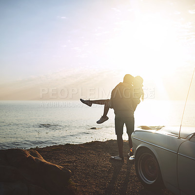 Buy stock photo Back, carry and travel with couple at ocean together for holiday, road trip or vacation with sunshine. Adventure, bonding or lifting with man and woman outdoor for anniversary, honeymoon or love