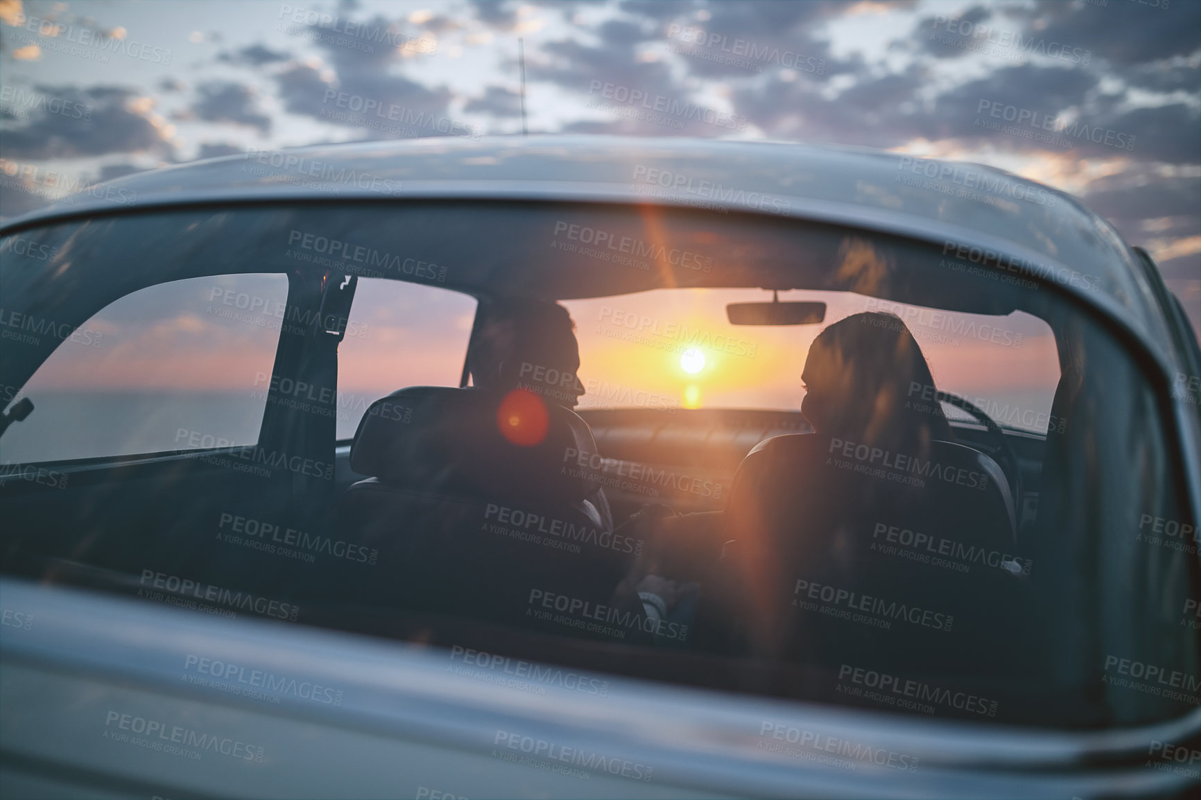 Buy stock photo Couple, sunset and back by beach for road trip, romance or holiday together with fun adventure in car. People, love and connection for travel, relationship or vacation with journey, bonding or relax 