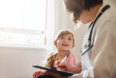 Buy stock photo Child doctor, girl and talking trust with medical checklist in a hospital for wellness and health. Happiness, clinic consultant and pediatrician with healthcare and appointment with a kid form