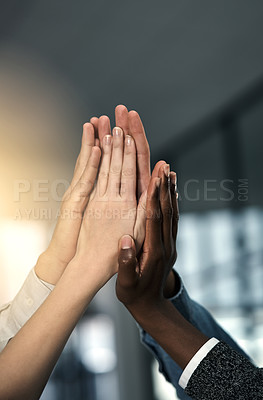 Buy stock photo Cropped shot of a group of businesspeople joining their hands in solidarity