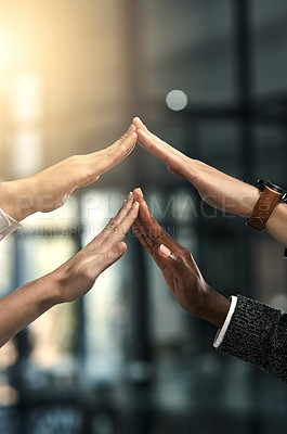 Buy stock photo Cropped shot of a group of businesspeople touching each others hands