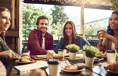 Buy stock photo Cropped portrait of an affectionate young couple out for lunch at a cafe with friends