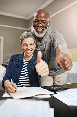 Buy stock photo Thumbs up, portrait and senior couple planning, asset management and financial success, winning or thank you. Happy face, finance or interracial people, woman or partner like, yes or ok hands at home