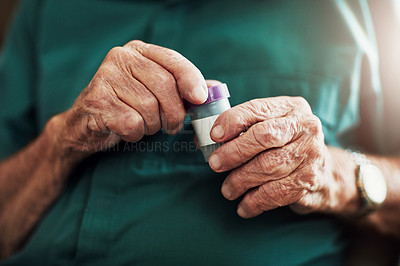 Buy stock photo Cropped shot of an unrecognizable senior man about to take his medication
