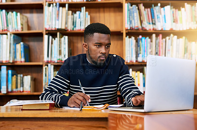 Buy stock photo University. library and student on laptop with research, planning or learning for exam, report or focus on studying, goals and education. Black man, college and working on task, essay or scholarship