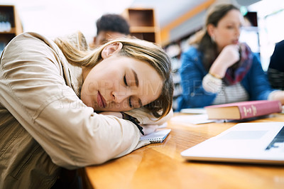 Buy stock photo Girl, student and sleep at college with group, burnout and tired with books, tech and education in library. Person, fatigue and exhausted with studying, learning or development in hall at university