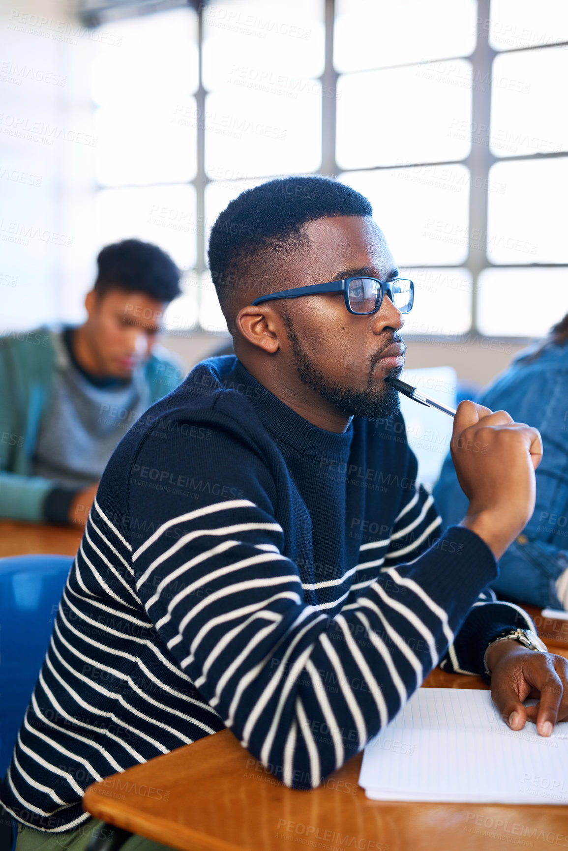 Buy stock photo Student, idea and black man in college classroom for education, test or exam. Thinking, university and study in lecture for problem solving, solution or brainstorming for learning knowledge at school