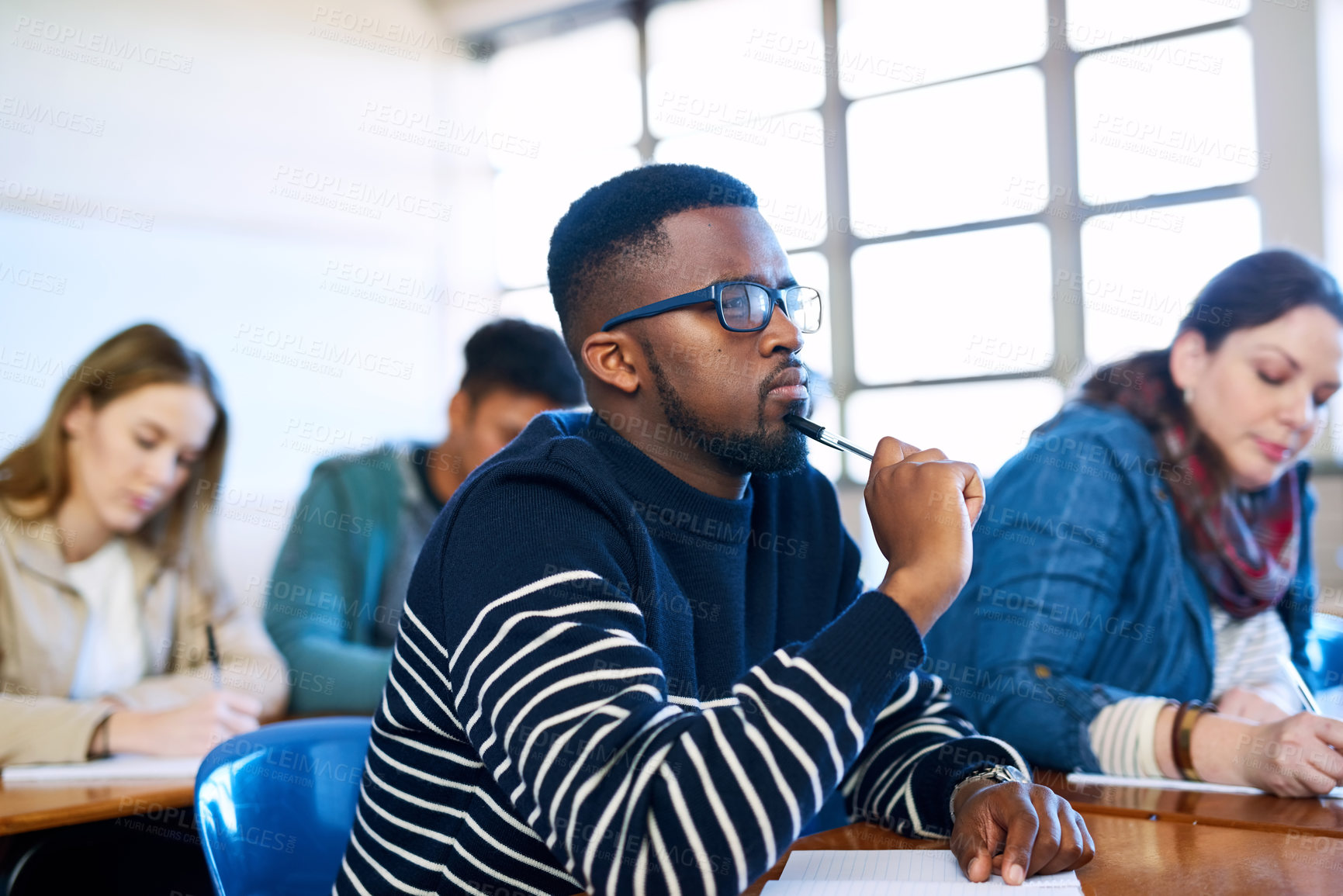 Buy stock photo Student, thinking and black man in university classroom for education, test or exam. Idea, college and studying in lecture for problem solving, doubt or brainstorming for learning knowledge at school