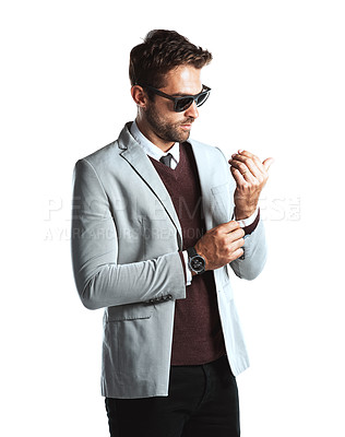 Buy stock photo Studio shot of a handsome young man posing against a white background