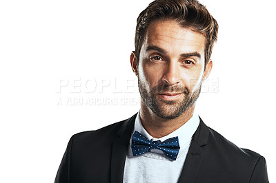 Buy stock photo Studio shot of a handsome young man wearing a tuxedo against a white background