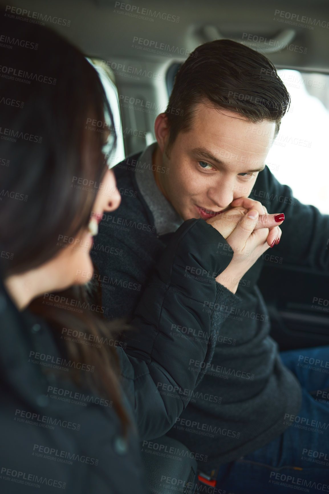 Buy stock photo Shot of a happy young couple out on a road trip