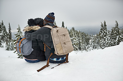 Buy stock photo Rearview shot of a couple admiring the snowy view