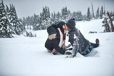 Buy stock photo Couple, travel and kiss in snow in nature for winter adventure, romance and exploring mountain together. People, love and outdoor for hiking, trekking and relationship with affection on mockup space