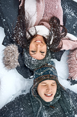 Buy stock photo High angle shot of a happy young couple out on the snow