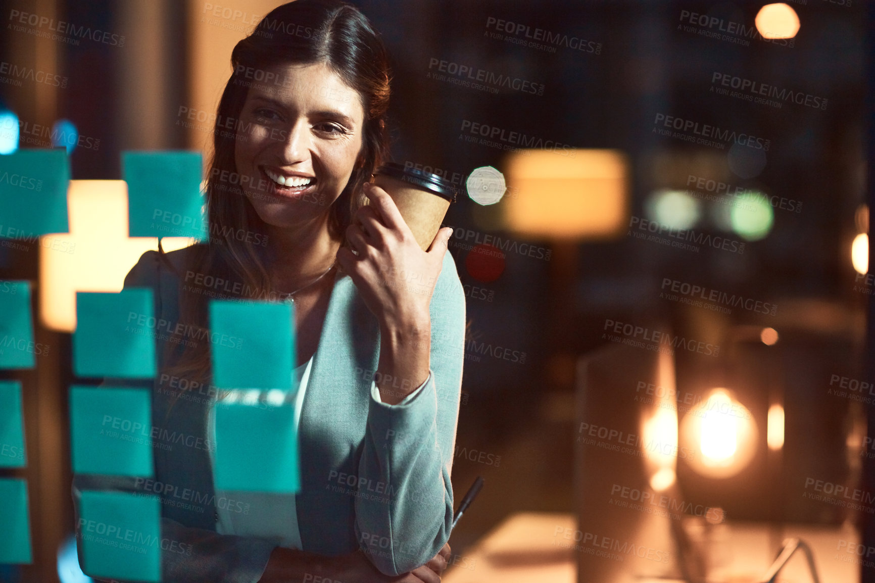 Buy stock photo Night, sticky note and business woman with glass board for strategy, project ideas or brainstorming in office. Dark, corporate and happy employee with coffee for planning, agenda or solution