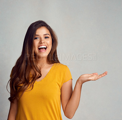 Buy stock photo Portrait, woman and smile with presentation in studio for advertising, information or announcement. Female person, happy and hand with mockup space for marketing, news or promotion on gray background