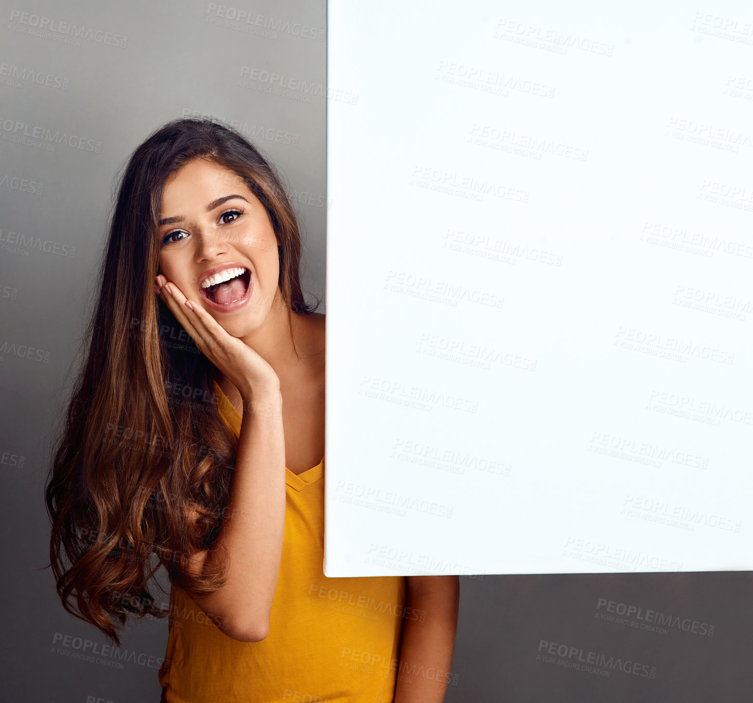 Buy stock photo Poster, surprise and portrait of woman in studio for good news, announcement and information. Happy, advertising and person with sign, bulletin or banner for sale, deal and bargain on grey background