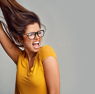 Buy stock photo Excited, glasses and woman with smile, celebration and winning on gray studio background. Person, model and girl with eyewear, cheerful and joyful with victory, success and carefree with confidence 