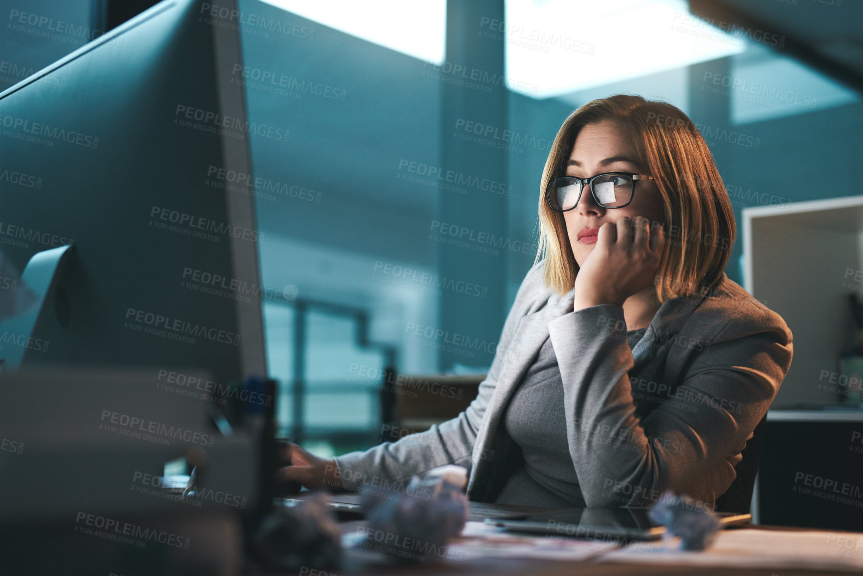 Buy stock photo Woman, employee and thinking on computer in office on browsing internet, online and research for ideas. Female person, business and night with deadline or overtime, project and reading as hr