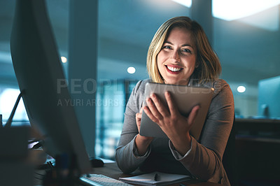 Buy stock photo Portrait of a young businesswoman working late on a digital tablet in an office