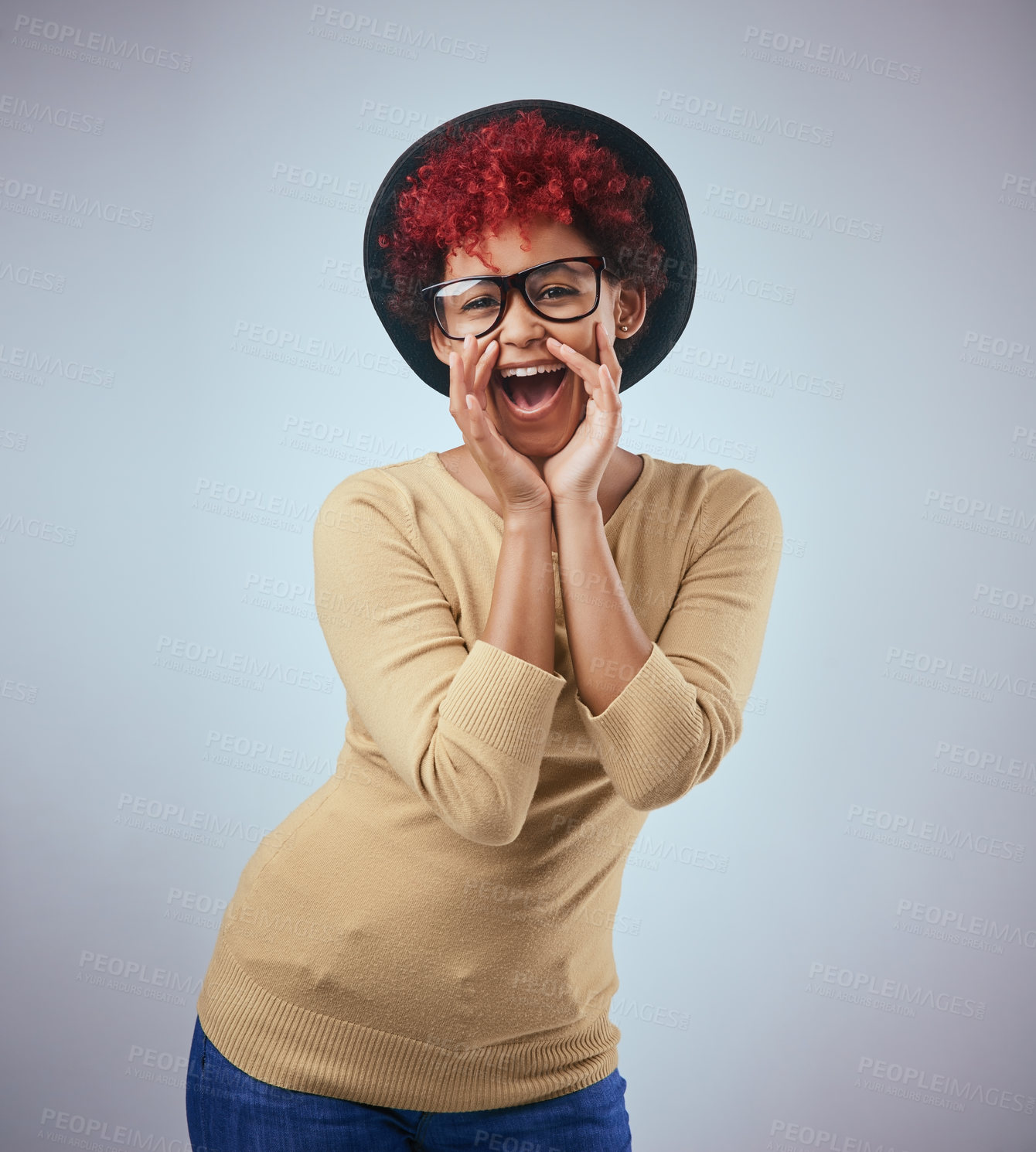 Buy stock photo Studio shot of a beautiful young woman wearing a hat against a grey background