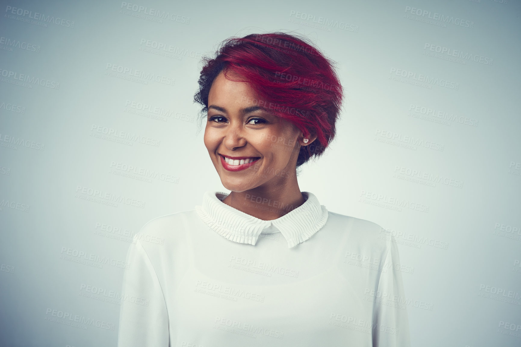 Buy stock photo African woman, happy and hair care in studio for confidence, texture and cosmetics with red dye. Female person, portrait and positive mood on gray background for hairdresser, salon and transformation