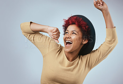 Buy stock photo Happy, woman and laughing with dancing hipster fashion and fun in studio, Smile, pop music and excited from celebration or motivation with minimalist style in grey background with carefree joy