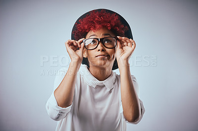 Buy stock photo Studio shot of a beautiful young woman wearing a hat against a grey background