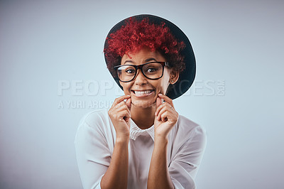 Buy stock photo African woman, silly and smile portrait with fashion and hipster style with excited and happy emoji face gesture. Studio, glasses and trendy eyewear with minimalist clothes with grey background