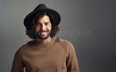 Buy stock photo Man, studio and happy with confidence for fashion on black background for style and trendy outfit. Male person, portrait and smile or satisfied with hat for edgy, smart and elegant clothes with swag