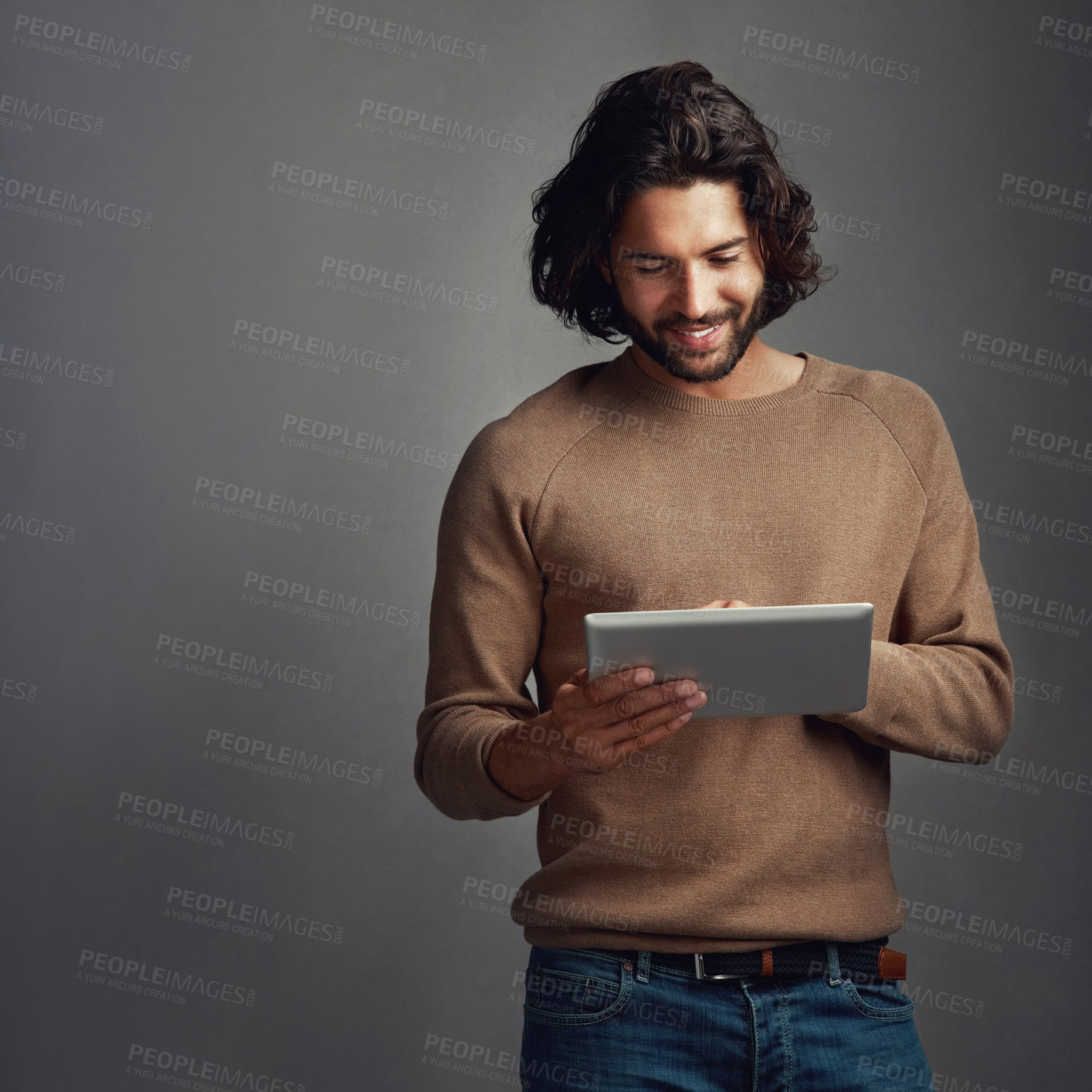 Buy stock photo Tablet, scroll and happy man in studio online for app, social media and reading email notification. Digital technology, typing and person on website for fashion blog isolated on gray background space