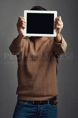 Buy stock photo Space, tablet screen and man covering face in studio isolated on a gray background. Touchscreen, hiding and male person with mockup for marketing, advertising and technology for commercial promotion.