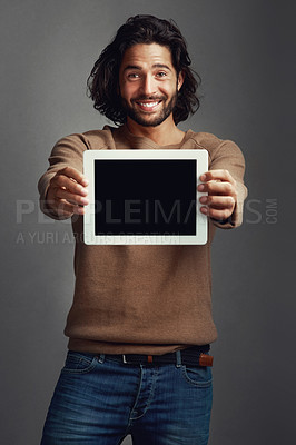 Buy stock photo Tablet screen, portrait and smile of man with mockup in studio isolated on a gray background. Touchscreen, face and male person with marketing, advertising and technology for commercial promotion.