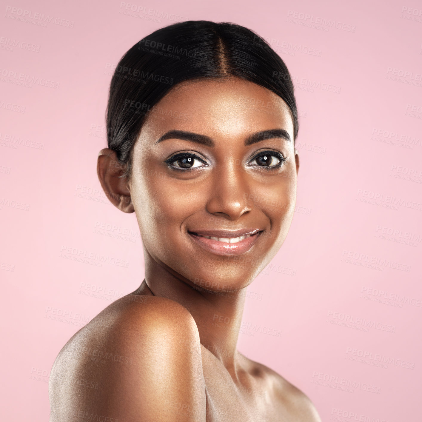 Buy stock photo Face, skincare and smile of woman in studio isolated on a pink background mockup. Portrait, natural beauty and Indian female model with makeup, cosmetics and spa facial treatment for healthy skin.