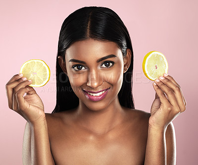 Buy stock photo Face, skincare and happy woman with orange slices in studio isolated on a pink background. Fruit, natural cosmetics and portrait of Indian female model with food for detox, nutrition and vitamin c.