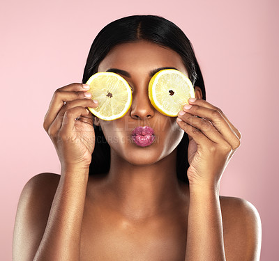 Buy stock photo Face, beauty and woman with lemon for skincare, makeup and wellness in studio isolated on a pink background. Fruit, cosmetics and model with food for health, nutrition and natural organic vitamin c