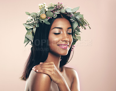 Buy stock photo Crown, face and flower with happy Indian woman in studio isolated on pink background for cosmetics. Aesthetic, eyes closed and wreath with perfect young model at salon or spa for natural cosmetics