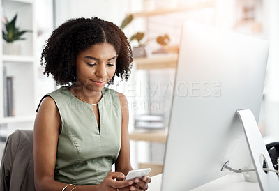 Buy stock photo Black woman, computer and cellphone texting in office as copywriter for article brief, networking or proposal. Female person, smartphone and market research for seo report, connection or internet